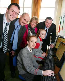Mella Weber and Norah O'Brien (Rang 6) work at reconfigured computers donated by CIT to Scoil Chlochair Mhuire’s technology hub at Carrigtwohill with Gerard Culley, CIT, and Michael Loftus, CIT and it@cork, Nora Moran, Principal, and Denis Collins, IBM and Chairman of it@Cork, at the launch of it@cork's e3 initiative for schools.